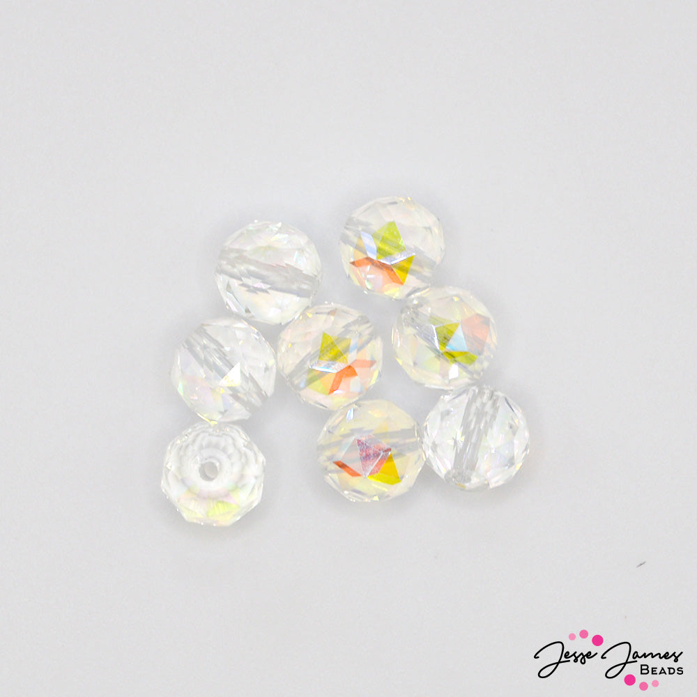 Capture a rainbow of undersea color with these mini faceted glass rondelle beads. Each crystal clear bead features a rainbow AB finish that captures hues of blue, purple, yellow, orange, and green when exposed to light. Sold in sets of 12. Each bead measures 8mm.