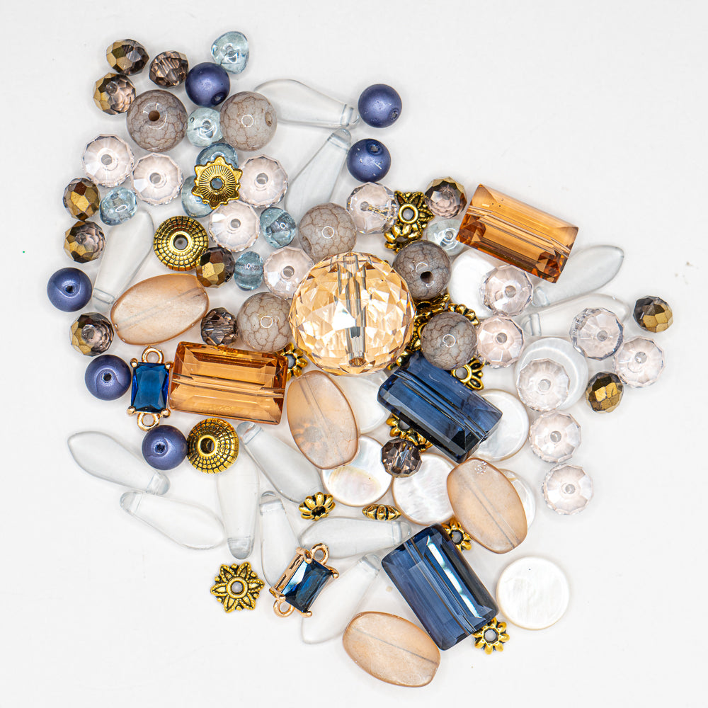Dive into the Catch of the Day with this stunning assortment of beads! This bold costal bead mix features sparkling pearl disks, mini glass pearls, faceted glass, sparkling Swarovski and more. Largest bead in mix measures 16.5mm. Smallest bead in mix measures 6mm x 4mm.