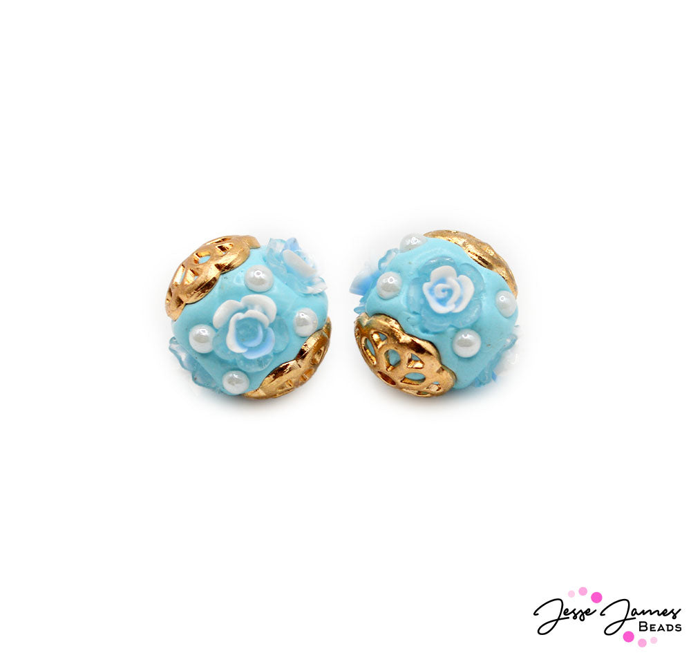 Don't be late for your appointment with the town dressmaker! This elegant fit of pearls and floral accents turns any jewelry piece into that worthy of a duchess. Each artfully crafted clay boho bead is accented with bright gold-metal plated bead caps. 2 beads per set. Boho measure 17mm.