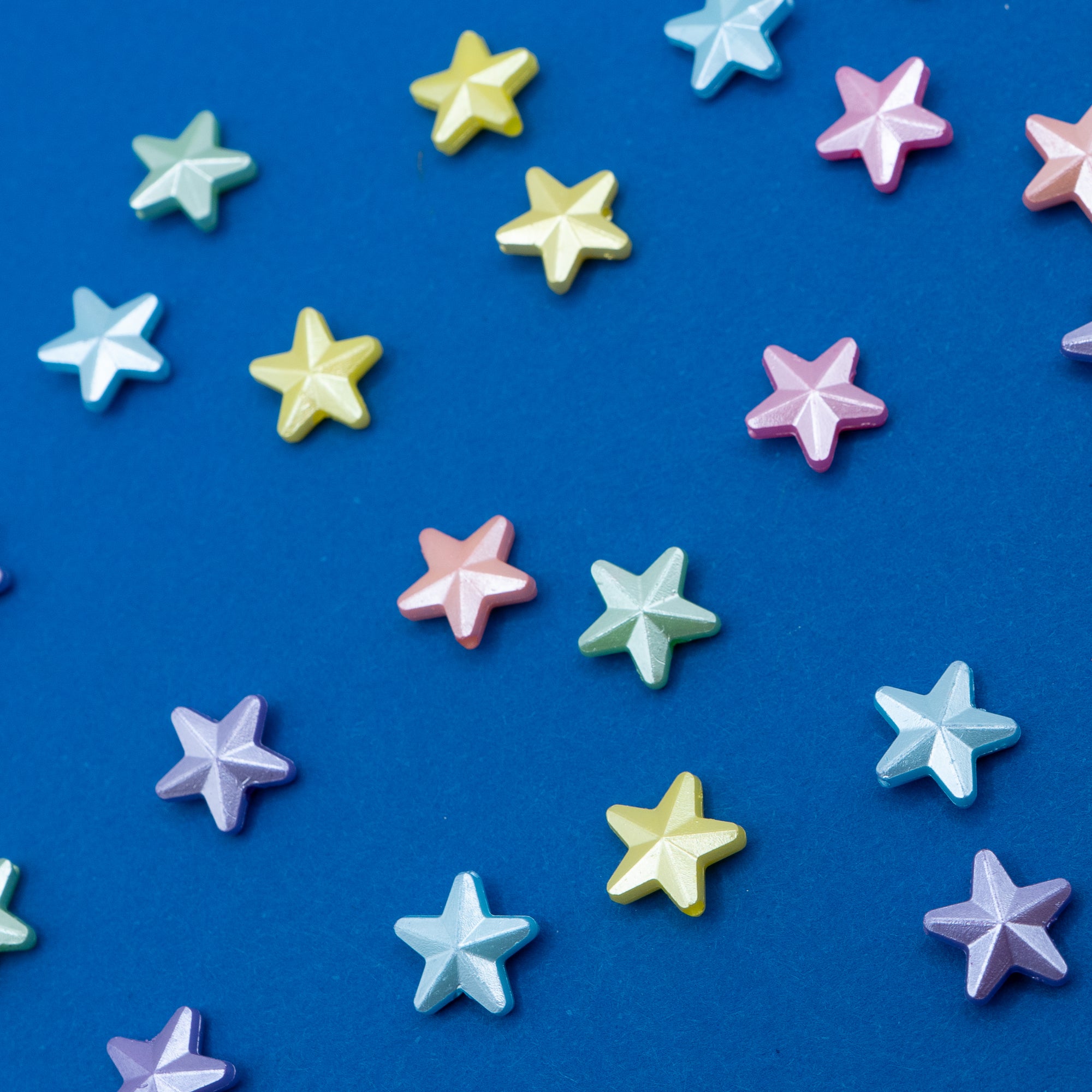 Colorful star-shaped objects on a blue background