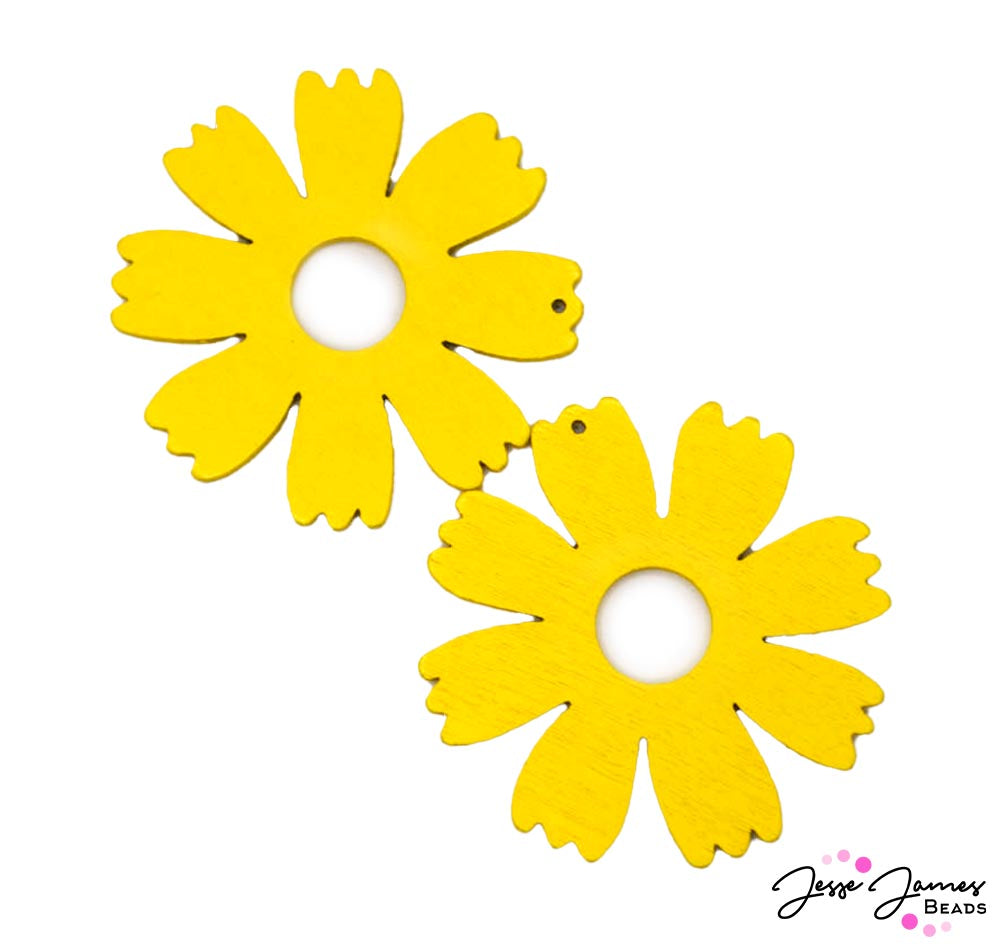 Channel the botanical elegance of Fairchild Botanic Garden into your jewelry creations. This wood pendant is Inspired by the intricate beauty of tropical blooms, each pendant features the simple floral shape colors a brilliant yellow hue. Each piece measures 48mm x 2mm. Sold in pairs.