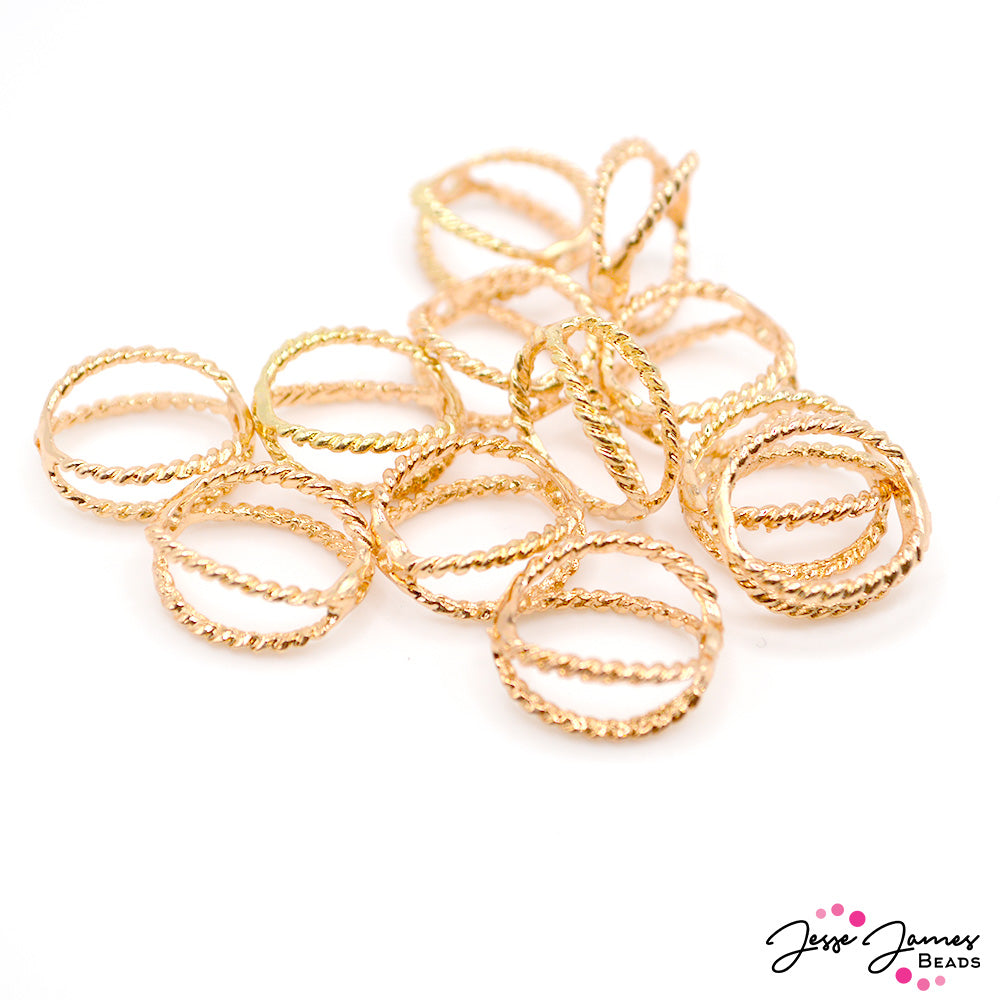 Add a golden frame to your favorite beads with these gold-plated metal bead frames. Each frame measures 14mm x 19mm. 