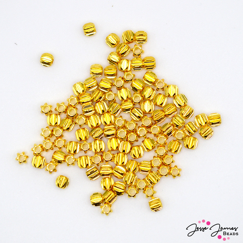 These adorable mini spacers feature a classic star shape. The bright gold finish adds a pop of metallic gold color and texture to your jewelry creation. Each piece measures 3.5mm in size. 100 pieces per set.