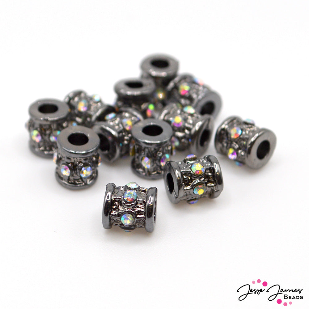 Add elegance to your next jewelry creation with these bold gunmetal rhinestone spacer beads. These beads measures 7mm x 5mm insize and feature AB crystal rhinestone accents. Beads come in a set of 12.