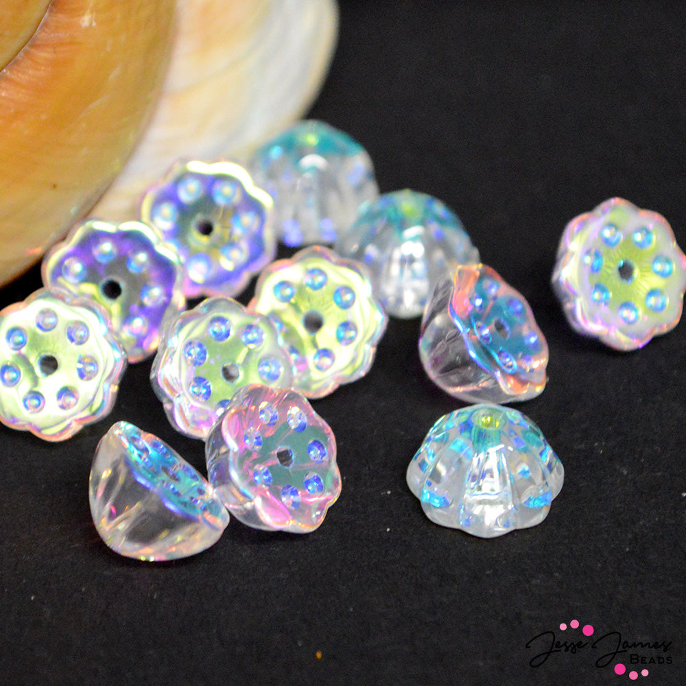 These AB Crystal beads add an abstract Jellyfish appearance to any jewelry project. Each piece features a high sparkle AB finish, adding a rainbow of color to any project. Each set includes 12 beads. Measure 11mm X 5mm. 