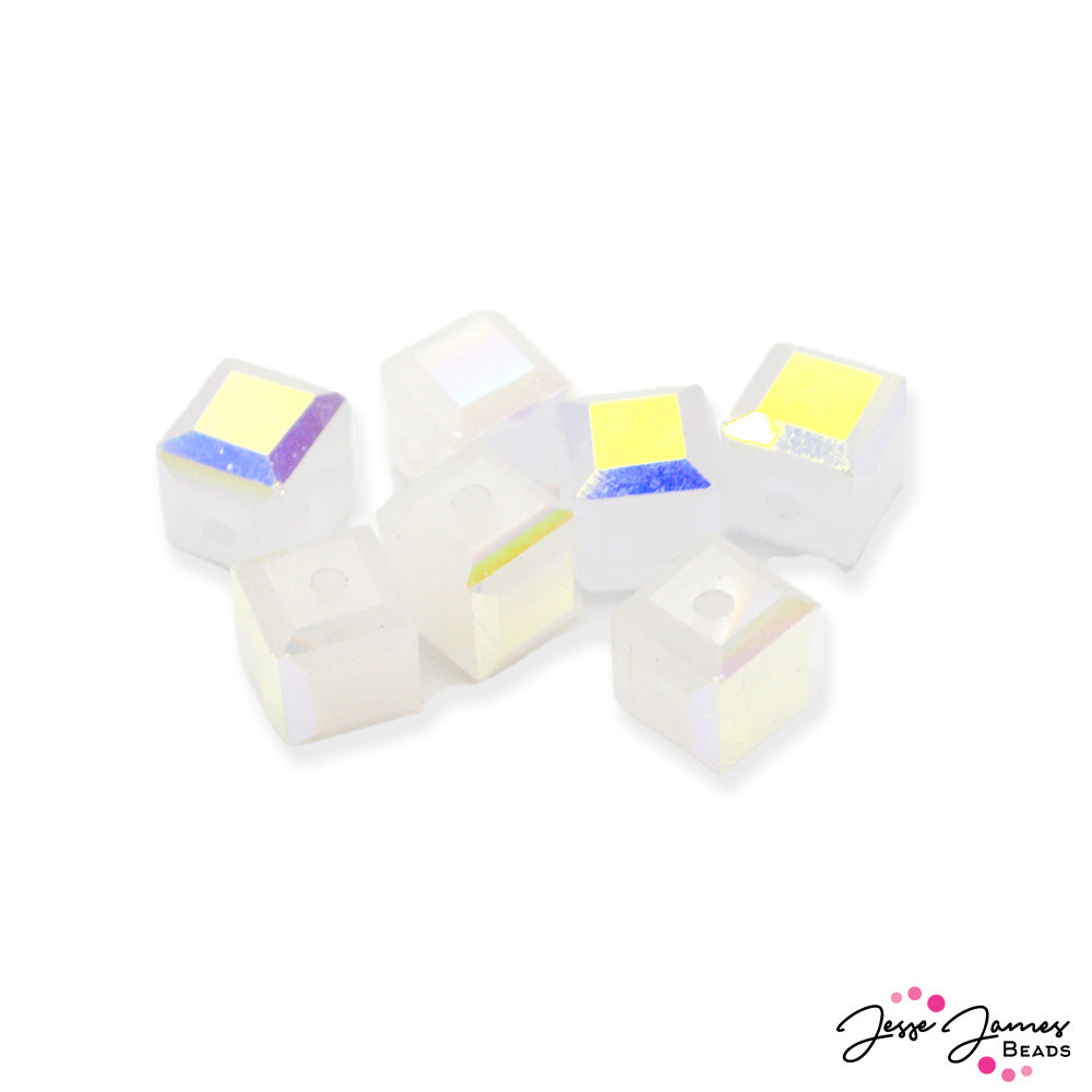 Add a chill to your next jewelry project with these mini AB white cube beads. These beads are sold in a set of 8. Measure 6mm.
