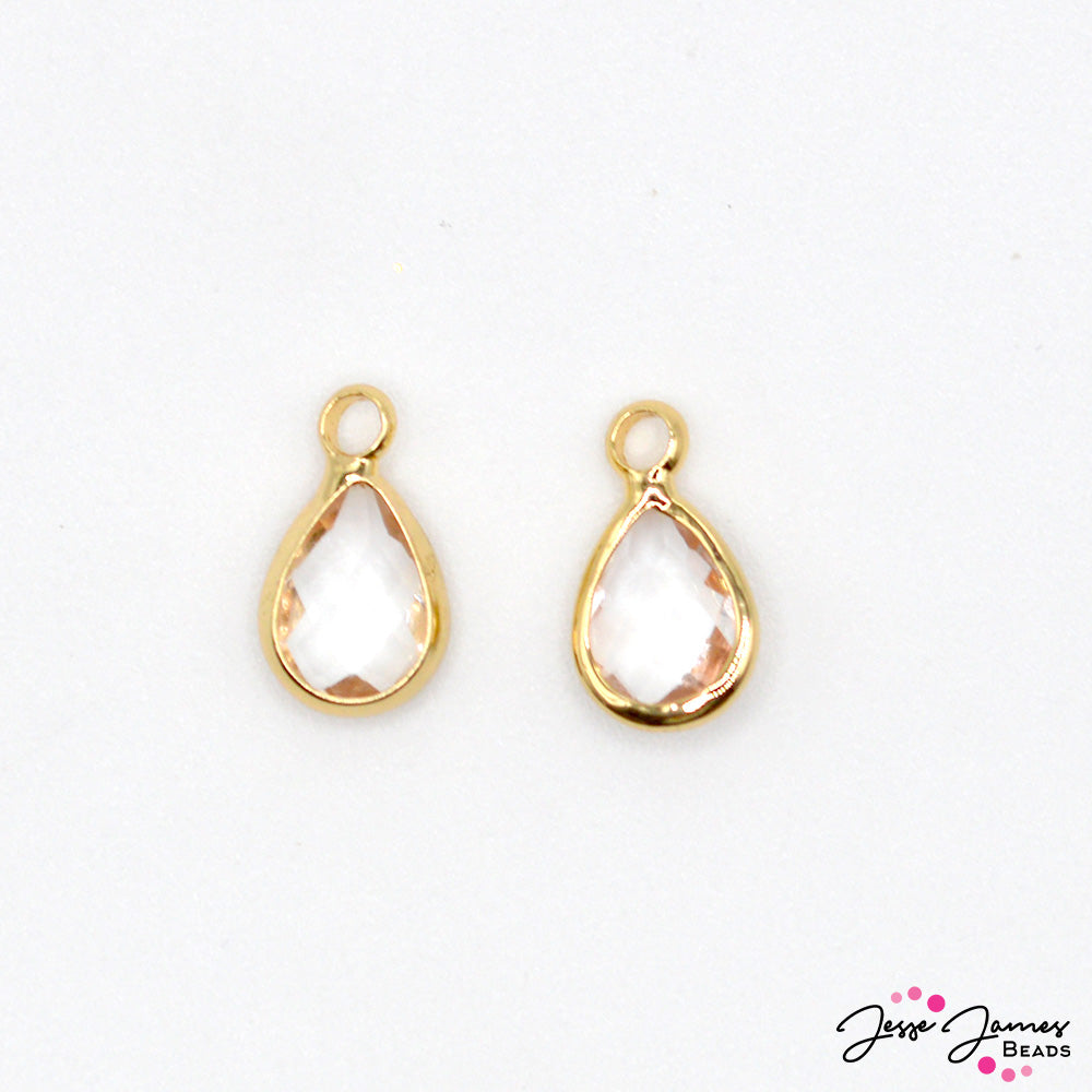 A delightful duo of tiny teardrop-shaped charms that radiate the warm and golden essence of honey. Charms measure 12mm X 6mm X 3mm. Each set contains 2 charms. 
