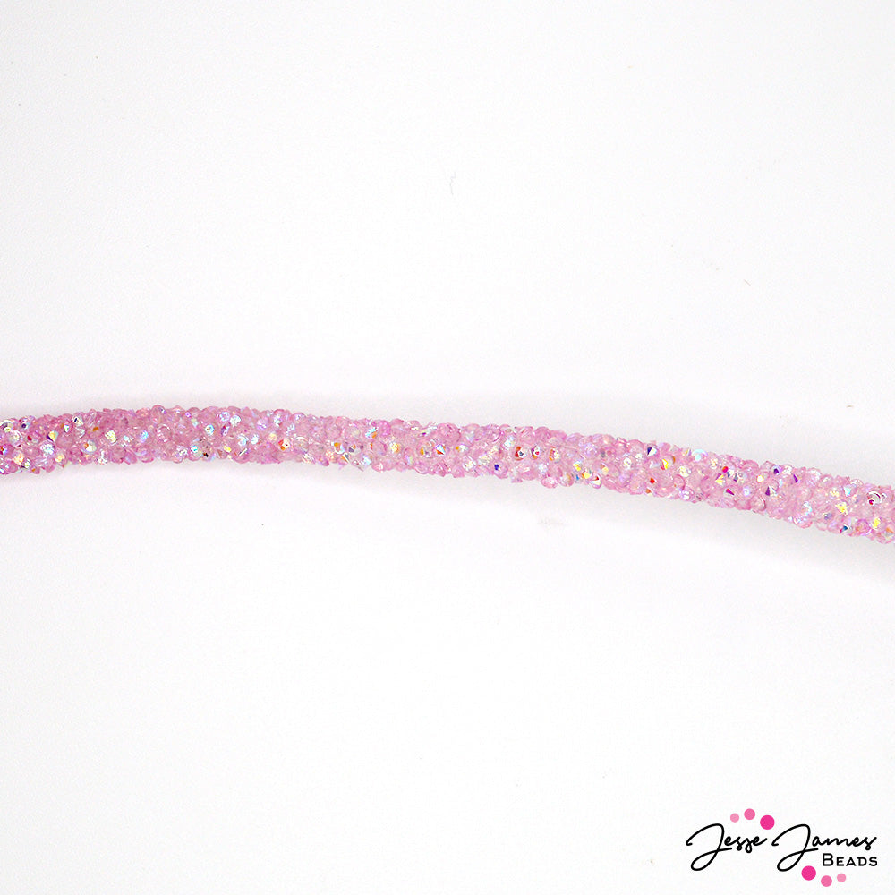 The subtle shimmer of the crystal-infused cord adds a touch of glamour to any project, catching the light and casting a gentle glow. Its jelly-like texture makes it fun to work with and perfect for unique bracelet designs. Sold by the foot. Comes with 4 cord ends. Measure 6mm. 