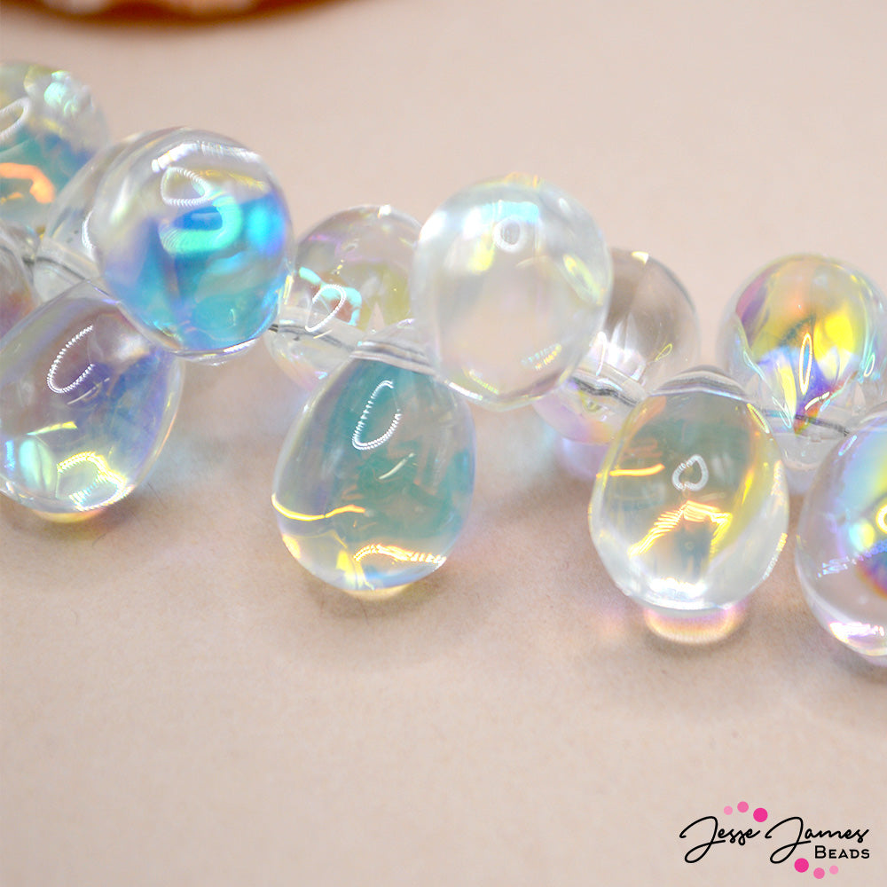 Indulge your creativity and elevate your designs with these AB glass droplets. Measure 14mm X 7mm. Each strand features approximately 110 beads.