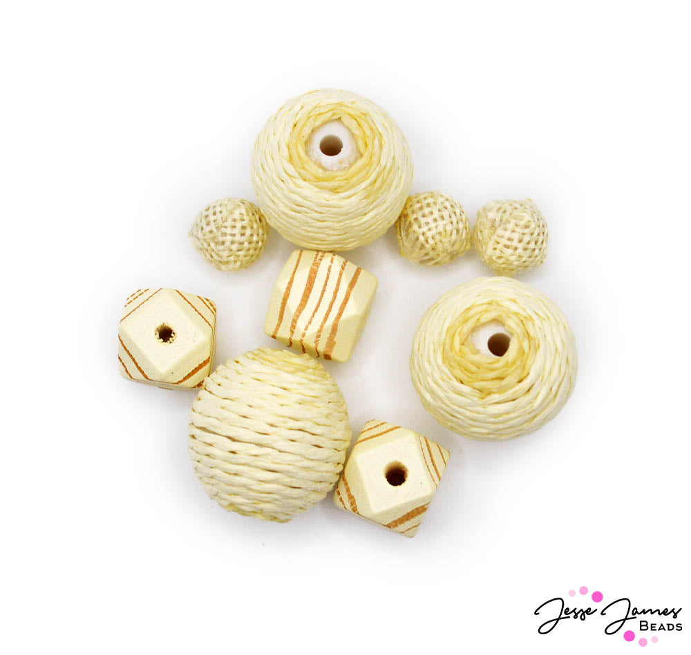 Create jewelry pieces inspired by light driftwood hues and natural textures. This bead set features 3 styles of beads in light wood hues. Largest bead measures 25mm. Smallest bead measures 12mm. Includes wood and yarn-wrapped beads. 