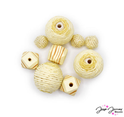 Create jewelry pieces inspired by light driftwood hues and natural textures. This bead set features 3 styles of beads in light wood hues. Largest bead measures 25mm. Smallest bead measures 12mm. Includes wood and yarn-wrapped beads. 