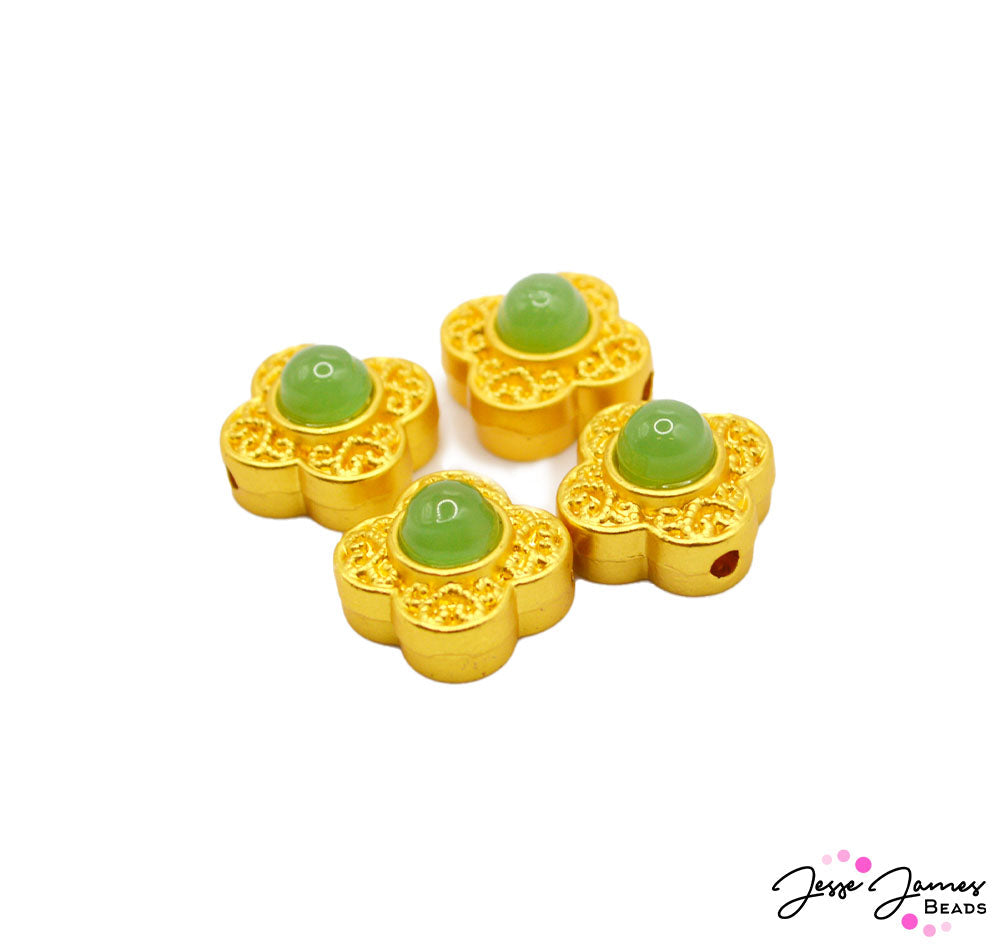 Dress your jewelry up to the nines with these elegant gold and emerald-colored focal beads. These luxurious accents feature a rich emerald green focal embraced in a gold-plated metal casing. Each set includes 4 glamorous beads to create with. Beads measure 13mm. 