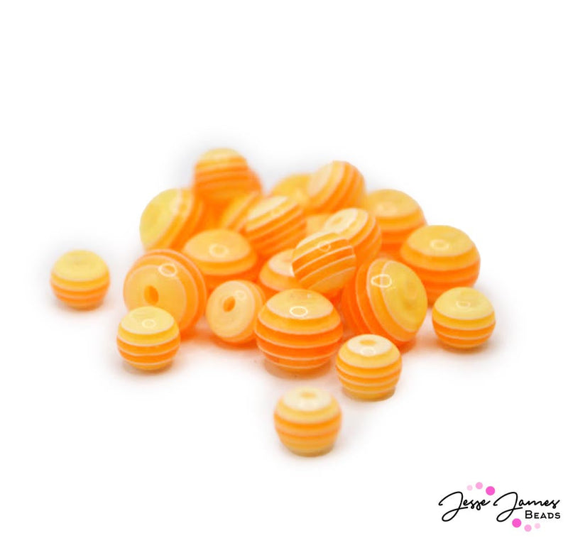 In need of a sweet treat on the beach? These creamy orange colored beads are the perfect touch. Each bead features a stripped blend of orange hues adding depth to earrings, necklaces, and more. Each bead set feature 12, 10mm beads, and 12, 8mm beads.