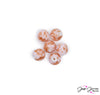 Enjoy the subtle flavor of a well-prepared berries & cream dessert with this darling collection of sparkling beads. Show a touch of whimsy at your next garden party event with these little beads swirled in creamy orange and pink glittered accents wrapped around a creamy white center. Each set includes 6 beads. Beads measure 10mm.