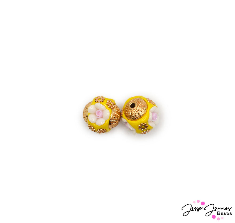 Adorn your jewelry creation in the beauty of buttercups with this pair of floral-inspired yellow boho beads. these lovely beads enhance the appearance of your necklace, earring, or bracelet designs with their bright color and elegant floral accents. 2 Beads per set. Bohos measure 16mm.