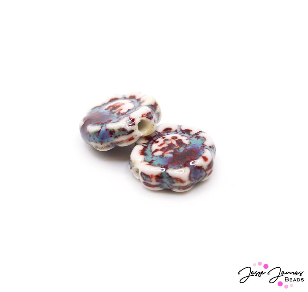 Enjoy the calm of the ocean with this tri-colored marbled ceramic bead pair. Each bead measures 18mm. Sold in pairs