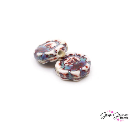 Enjoy the calm of the ocean with this tri-colored marbled ceramic bead pair. Each bead measures 18mm. Sold in pairs