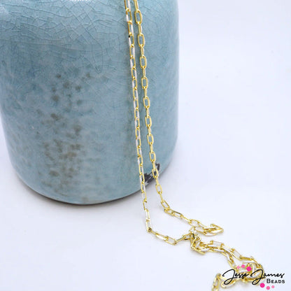 This dainty gold paperclip style chain features a touch of white enamel on each link, perfect for necklaces, bracelets, and more. Chain is sold in 1 meter increments. Each link measures 7mm x 3mm x 0.8mm.