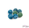 Add a pop of color to your jewelry creations with these yarn-wrapped beads dyed oceanic hues. This set includes dark blue, deep teal and green dyed beads. Beads measure 16mm. Each set includes 2 of each color bead.