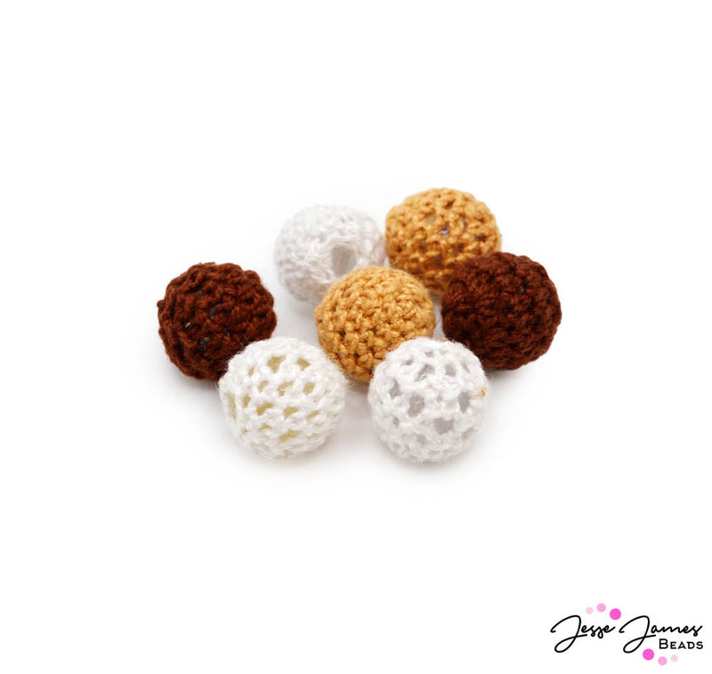 These fiber spun beads are dyed in neutral hues perfect for creating natural beachside jewelry. This bead set includes white, tan, and dark brown beads. Beads measure 16mm. Each set includes 2 tan, 2 brown, and 3 white beads.