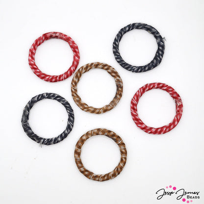 Dust the sand off your blanket and get ready for a picnic. This set of fabric wrapped loops features 40mm sized beads in three stunning colors. Each set features 2 red wrapped loops, 2 black, and 2 brown. Please note there are no additional holes on these rings, can be attached to wire or cord via macrame or jump ring! 