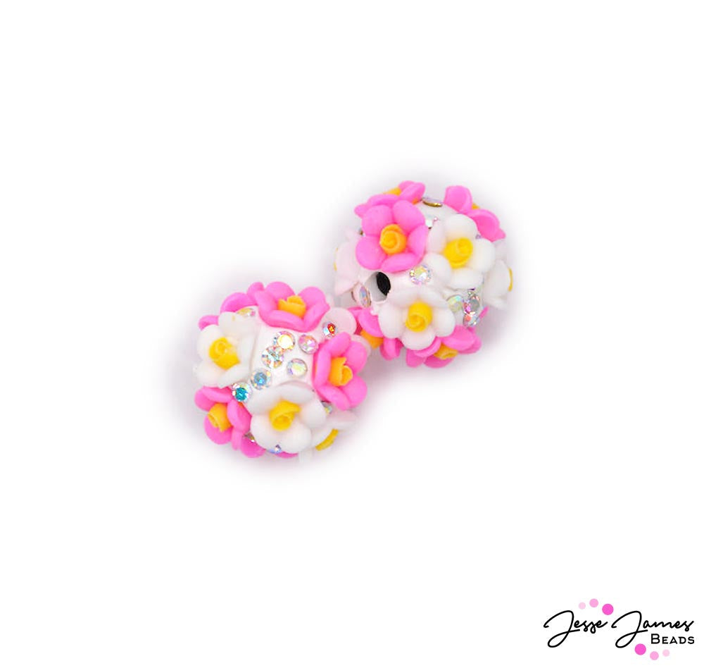 Let these bohos transport you to a time when pool parties were all the rage and every day felt like a vacation. With these acrylic floral focal beads, your jewelry designs will be the toast of the town, capturing the essence of a bygone era. Dive into the golden age of summer and create something truly fabulous! Each bead measures 16mm x 20mm. Sold in pairs. 