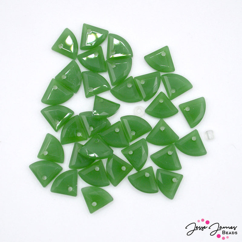Embrace the beauty of nature with our Gingko Glass Dark Green Bead Set. Let the rich color inspire you to craft jewelry pieces that are both elegant and meaningful. Beads measure 8mm X 9mm. 34 beads per set. 