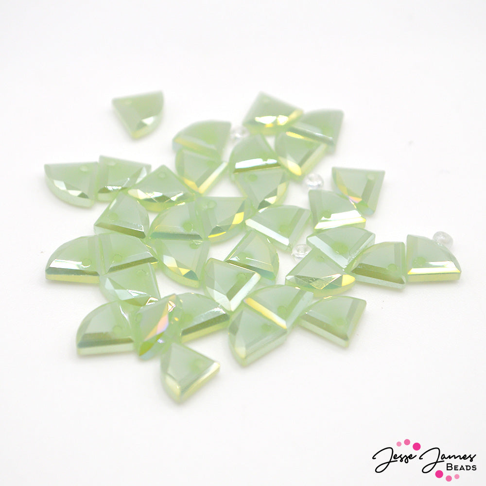 This bead set captures the essence of springtime freshness with its light green hue, offering a serene and uplifting palette for your jewelry-making projects. Beads measure 8mm X 9mm. 34 beads per set. 