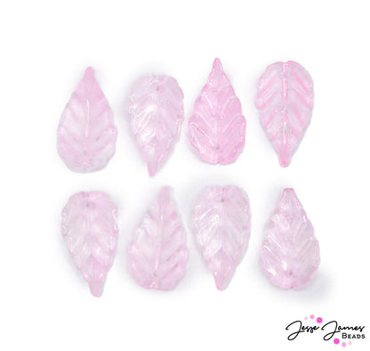 Add a touch of pink to your next look with these transluscent pink leaf charms. These charms are sold in a set of 8. Perfect for making earrings, bracelets, and more.