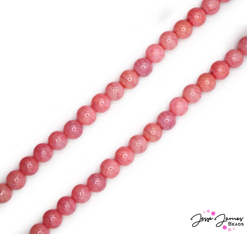 Transport yourself to the vibrant rhythms and colorful streets of 1950s Havana with our Glass Bead Strand in Little Havana! From the cobblestone alleys to the bustling marketplaces, these glass beads capture the essence of a city where every corner tells a story. 80 beads per strand. Each bead measures 10mm sized beads.