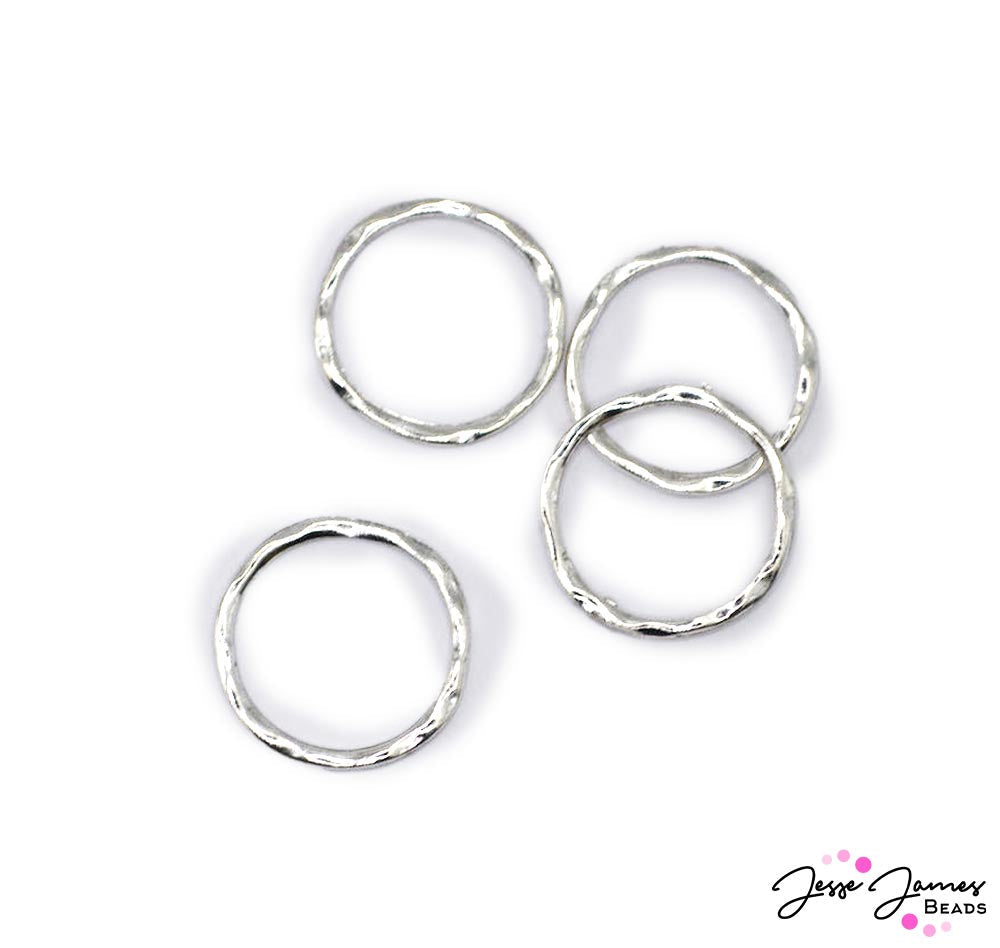 Explore new dimensions in jewelry making with our Hammered Links Set in Silver, designed to ignite creativity and add an elegant touch to your projects! Use as is or adorn with seed beads, wire-wrapped accents, and beyond for unique necklaces, bracelets, earrings, and more. Measures 24mm round. 4 per set