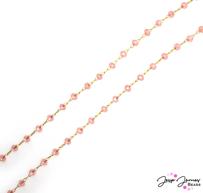 This brass chain features 4mm glass bead links for a pop of bold coral color. This chain is sold in 24-inch increments. 