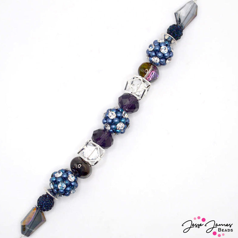 This robust 7 inch bead strand features rich blue and purple hues. Each strand includes large bubble beaded beads accented with faceted glass, rhinestones, and more. Largest bead on strand measures 17mm. Smallest bead on strand measures 10mm x 4mm. 