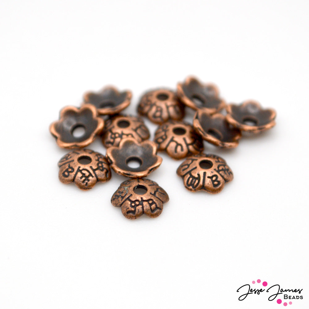 These classic JJB copper bead spacers are perfect for encasing your favorite focal beads. Each bead measures 5.5mm x 2mm. Each set includes 12 beads.