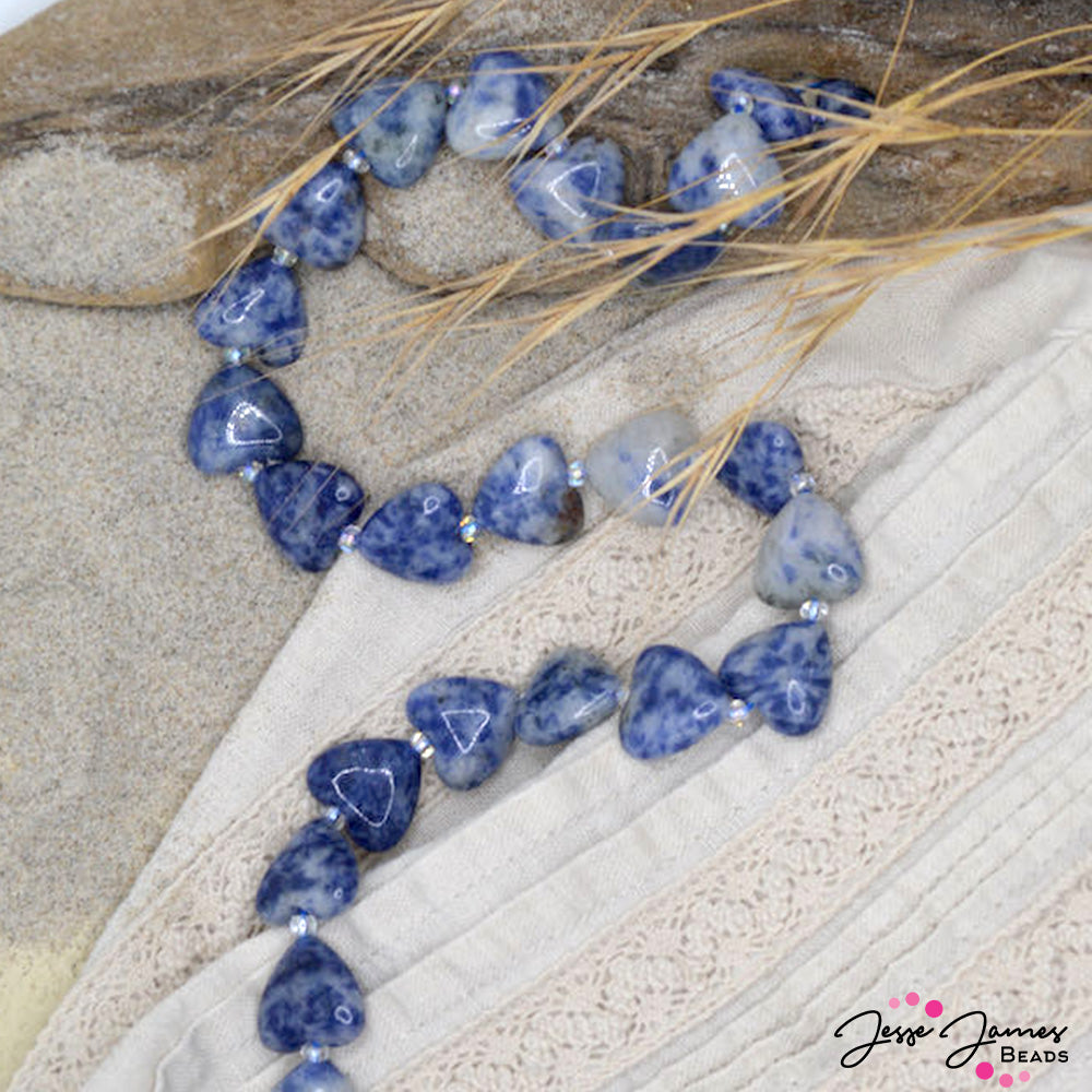 These beautiful heart shaped Sodalite beads feature a marble of color! Each heart measures 14.8mm x 13mm hearts. 24 pieces per strand.