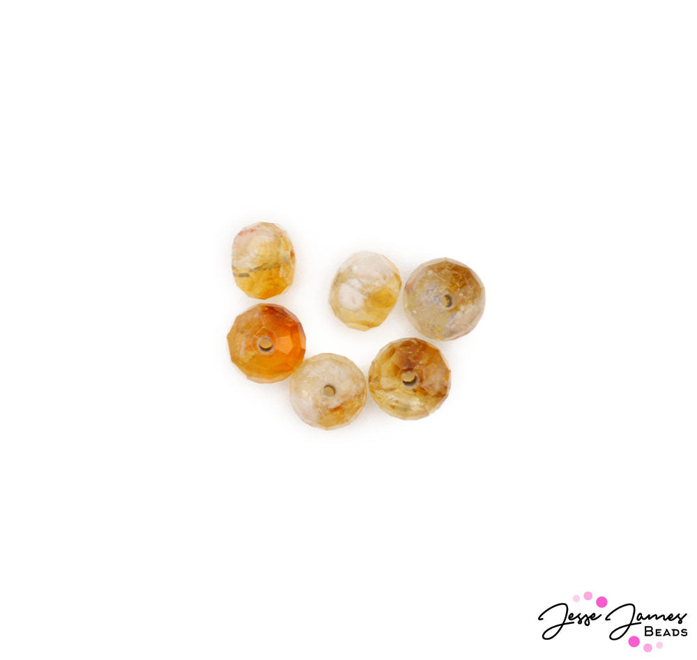 Project an elegant air of confidence when adorned in these bright citrine faceted beads. These bold beads encase the light of dawn in their shimmering orange hue. Each bead features it's own unique pattern of sunrays, capturing their bold and beautiful natural grain.