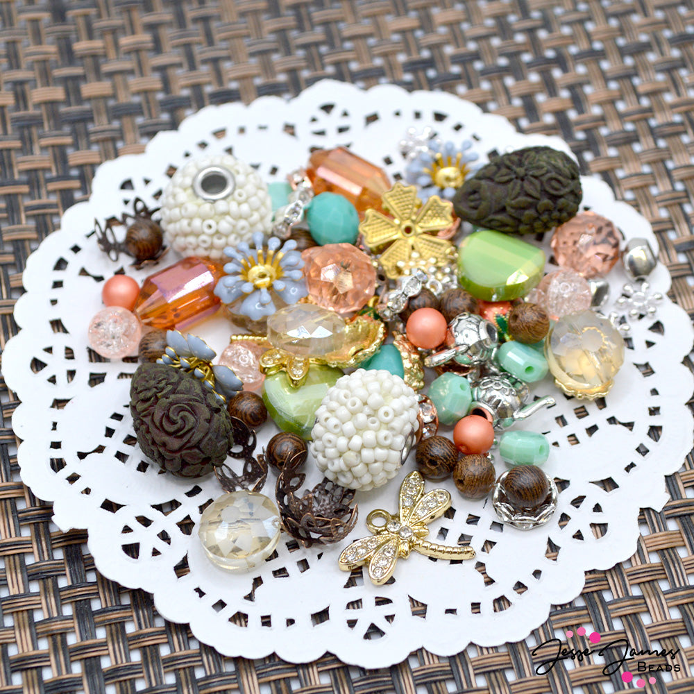 A basket full of color inspiration! This exclusive bead mix feautres a variety of faceted glass, custom metals, seed bead sprinkle bohos, custom dyed enamel flowers, strawberry charms and more. 1 mix per order. Largest piece in mix measures 18mm. Smallest bead measures 4mm. 
