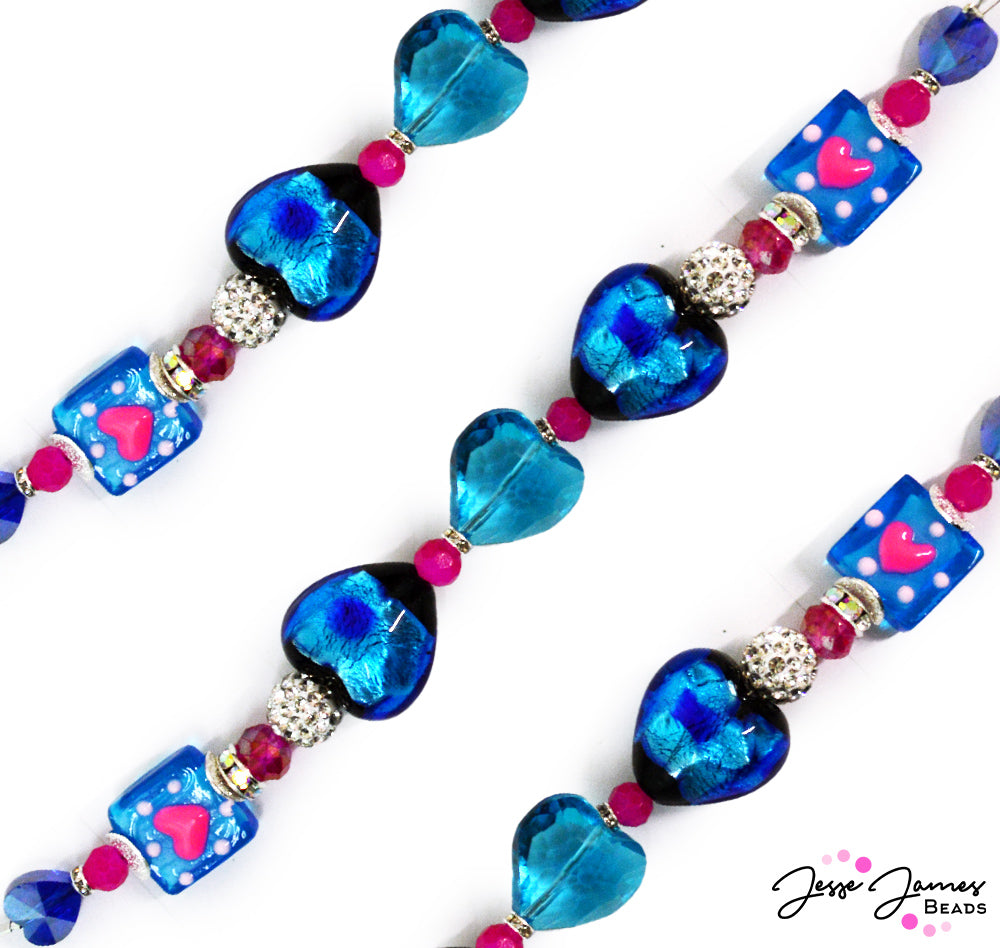Don't let love leave you blue! This cool blue 6.5 inch bead strand features lampwork hearts and square heart beads paired with rhinestone mini boho beads, mini faceted glass, and rhinestone spacers. Largest bead on strand measures 19.6mm x 20mm x 13.5mm. Smallest bead on strand measures 2mm x 4mm.