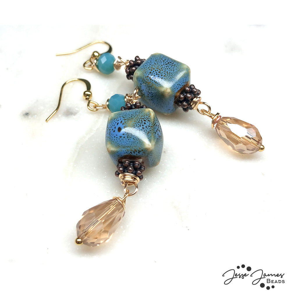 Wanderlust inspired earrings using beads from Jesse James Beads. tutorial by Brittany Chavers.