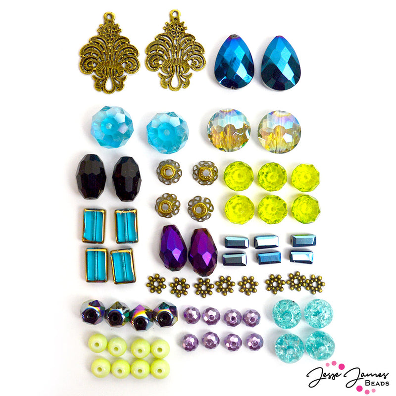 Peacock color Trends bead mix from Jesse James Beads featuring faceted glass beads, custom metal bead caps, custom metal spacers, metal connector pendants, and more.