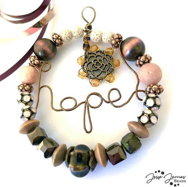 Stone age wire-wrapped ornament. Tutorial b y Shelley Penney.