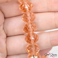 Dive into these rich tan/pink beads! Perfect for creating Spring and beach-ready designs, these glass beads measure 12mm x 8mm. 68 beads per strand. Strands sold individually. Hole size measures approx: 1mm.
