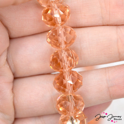 Dive into these rich tan/pink beads! Perfect for creating Spring and beach-ready designs, these glass beads measure 12mm x 8mm. 68 beads per strand. Strands sold individually. Hole size measures approx: 1mm.