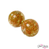 Create unique desert inspired jewelry with these sandstorm inspired handmade lampwork beads. These beads feature a blend of rich tan color paired with hidden pockets of glitter for added sparkle. Beads come in a set of 2. Each bead measures 20mm.