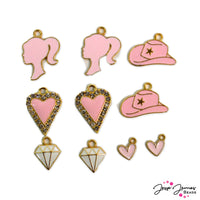 Start your own dreamhouse life with this bold pink and gold charms! This set of charms features hearts, diamonds, cowboy hats, and more all in a bold pink color! Largest piece in mix measures 21mm x 15mm x 2mm. Smallest piece in mix measures 14mm x 11mm x 2mm.