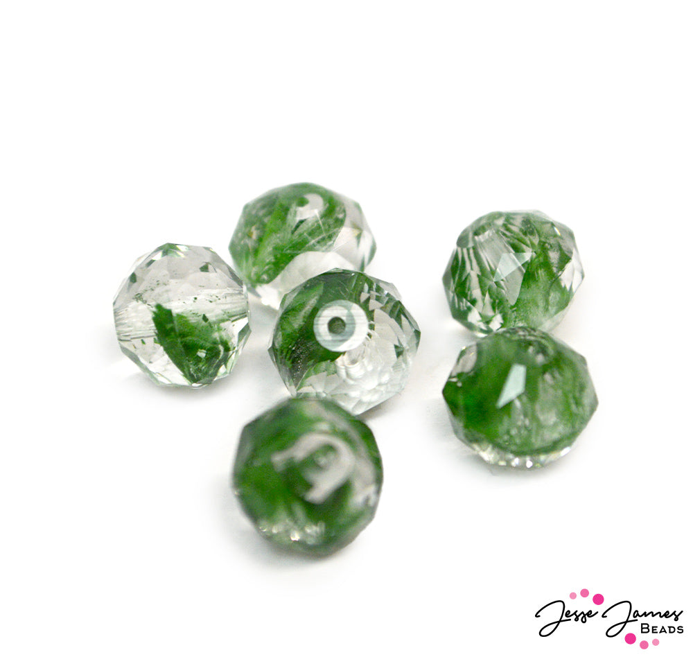 Like a breath of fresh air, these ethereal green porphyr glass beads. The green porphyr stripe runs through the glass bead, dancing and creating a really unique bead design! These beads are sold in a set of 6. Glass beads perfect for jewelry making! Each piece measures 8mm x 10mm.