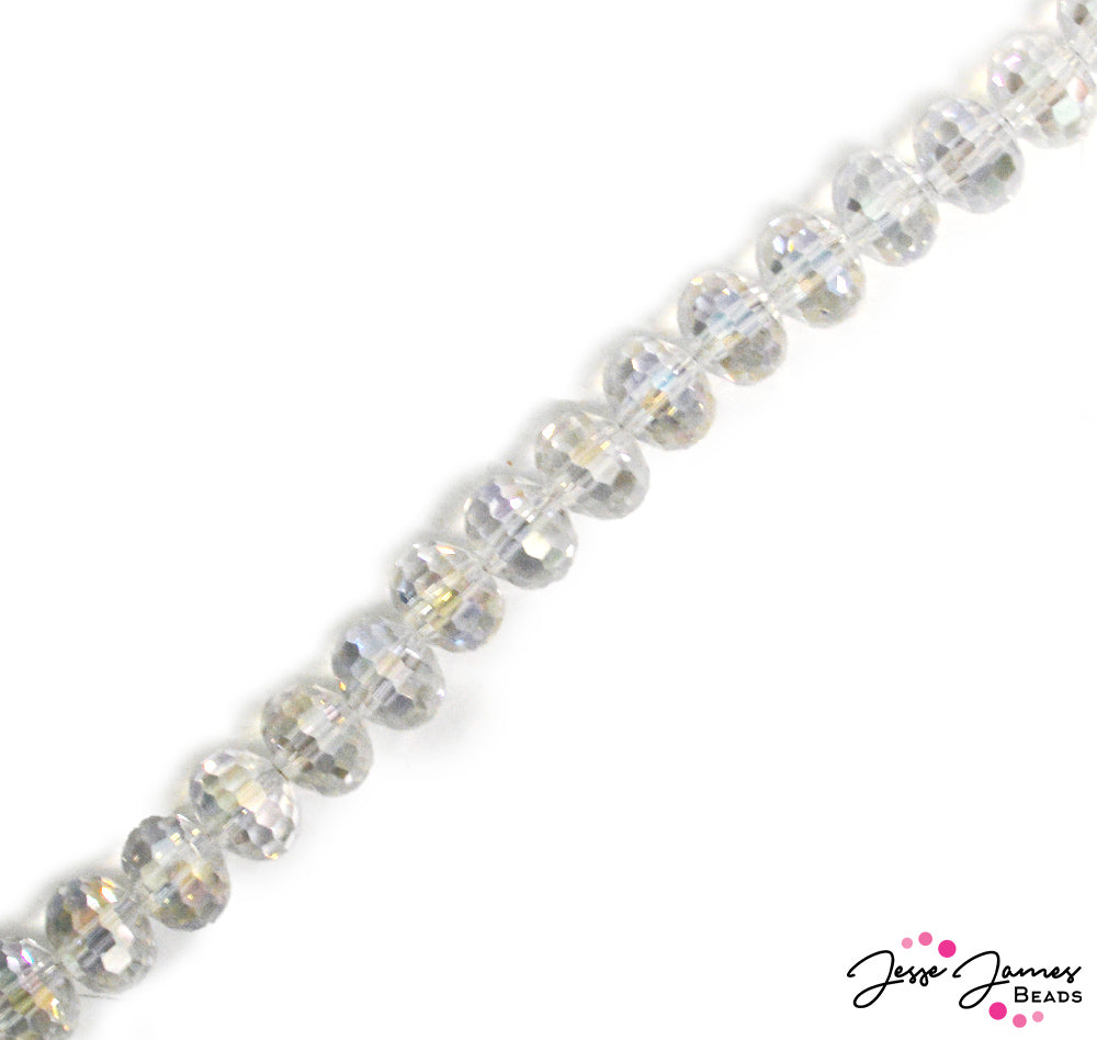 Crystal beads faceted so many times they captivate! Love sparkle? You need these beads. The crystal is perfectly cut to reflect the light, each with AB finishing to really reflect those rainbows. 70 beads per strand. Beads measure 9mm x 7mm.