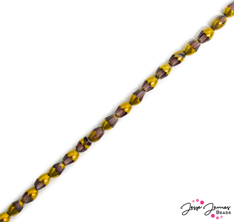 These plum purple glass beads are golden dipped in elegance, dripping in the sauce. Bitty beads add elegance and gorgeousness to your jewelry projects. Use for earrings, bracelets, necklaces and beyond. 50 beads on a string. Each bead measures 7mm x 4.5mm.