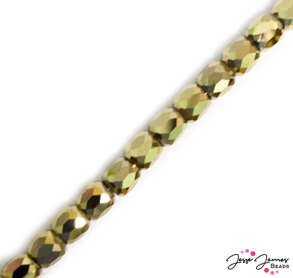 House of Gold metallic glass beads add the glitz and all the drama to jewelry making. Go bold and fearless with big barrel beads. Approximately 45 beads per strand. Each bead measures 8mm x 10mm. Approx 45 beads per strand.