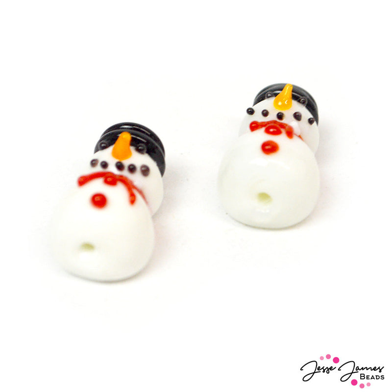 Are you feeling frosty? These adorable handmade lampwork stye beads add a glamorous touch of Winter to any design project. Snowmen feature flat backs so that they can lay flat on neckalces, bracelets, and more. Each snowman measures 21.2x12.2x11mm, Hole: 1.4mm. Sold in pairs. Lampwork beads may vary slightly from picture due to the hand-made nature of these glass beads.